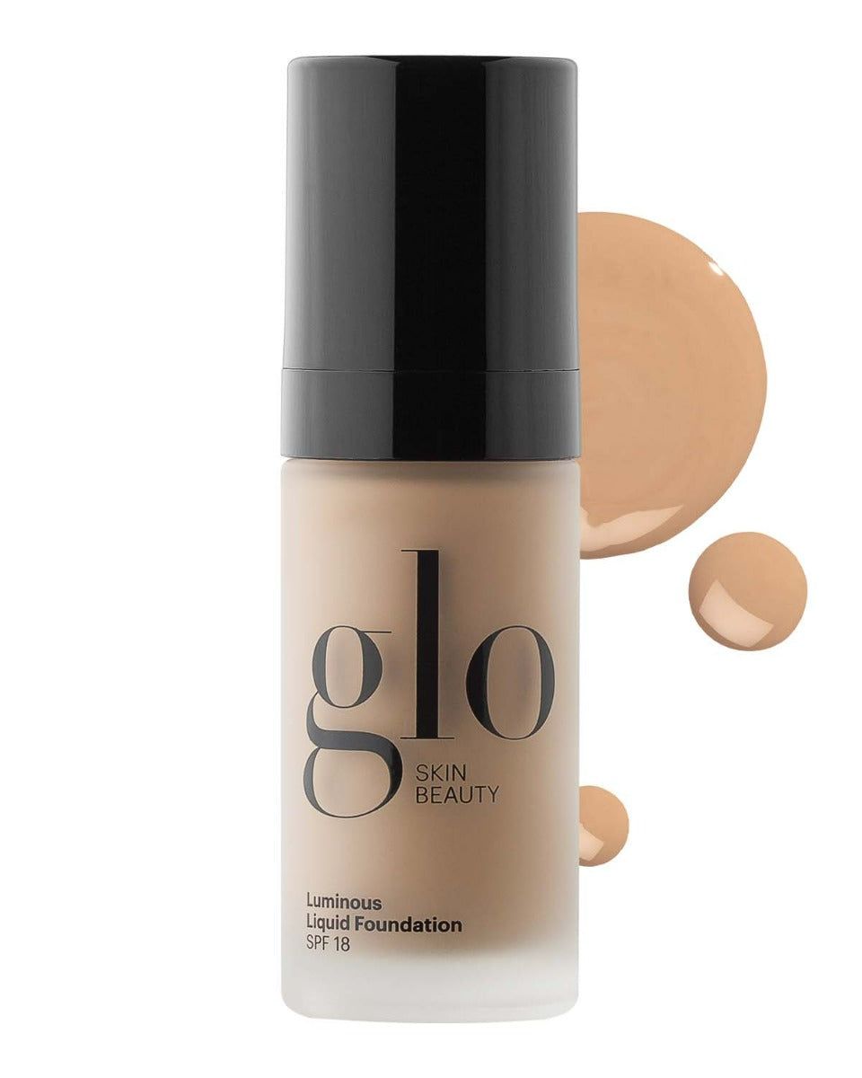 Glo Skin Beauty ŠVYTĖJIMO SUTEIKIANTIS SKYSTAS MAKIAŽO PAGRINDAS SU SPF 18 / LUMINOUS LIQUID FOUNDATION SPF 18 ALMOND